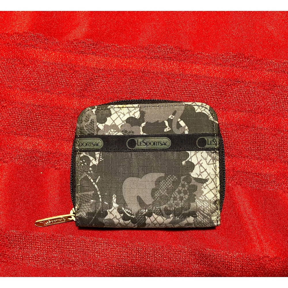 EUC LeSportsac Wallet in black lace print. The perfect size for smaller handbags